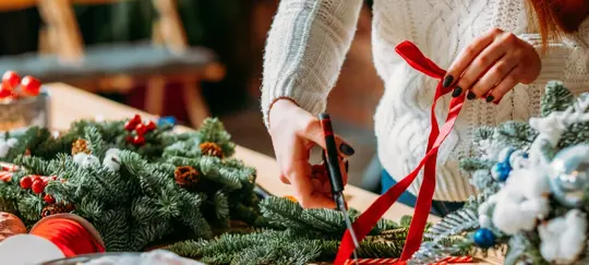 woman with red Christmas ribbon
