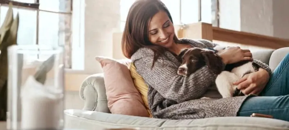 woman with dog on couch