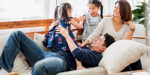Family laughing and playing in pest free home